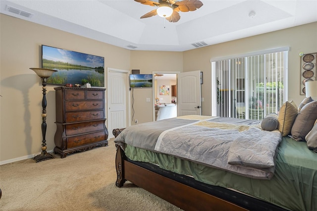 4018 Chandler Estates Dr, Apopka, FL 32712 - carpeted bedroom featuring a raised ceiling, ceiling fan, and access to exterior
