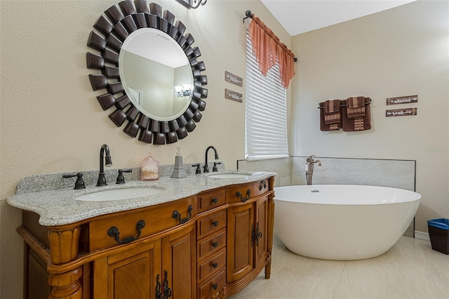 4018 Chandler Estates Dr, Apopka, FL 32712 - bathroom with a soaking tub, double vanity, and tile patterned floors