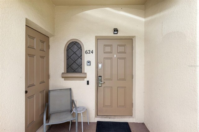 624 Terra Lago St, Davenport, FL 33897 - doorway to property with stucco siding