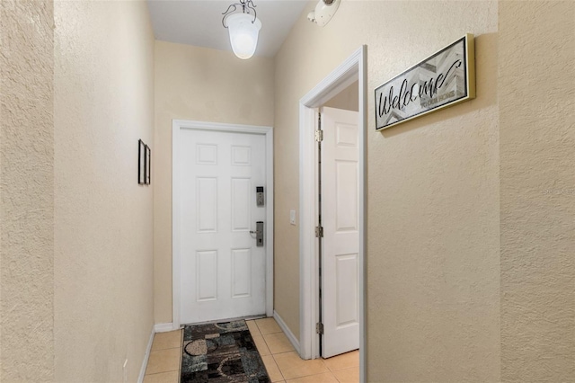 624 Terra Lago St, Davenport, FL 33897 - doorway to outside featuring a textured wall and light tile patterned floors