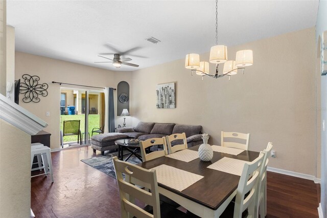 624 Terra Lago St, Davenport, FL 33897 - dining area featuring dark wood finished floors, ceiling fan, and a chandelier
