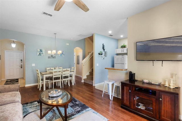 624 Terra Lago St, Davenport, FL 33897 - living area with arched walkways, stairs, wood finished floors, and recessed lighting