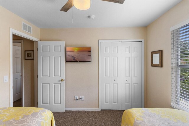 624 Terra Lago St, Davenport, FL 33897 - carpeted bedroom with a closet and a ceiling fan
