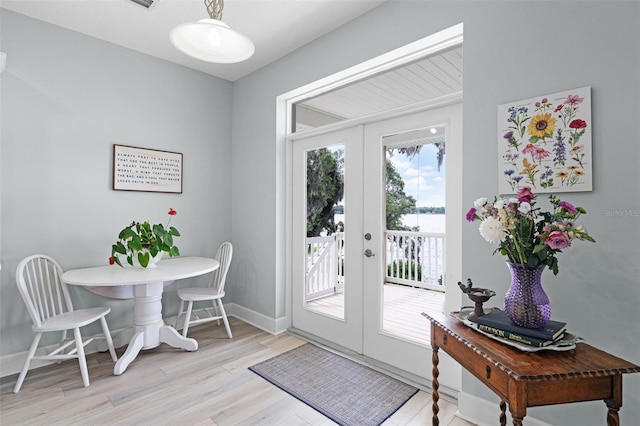 6136 Lake Emma Rd, Groveland, FL 34736 - doorway featuring french doors and light wood-style floors