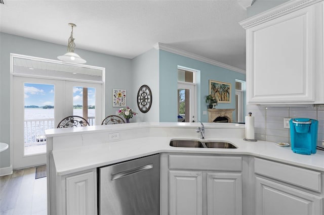 6136 Lake Emma Rd, Groveland, FL 34736 - kitchen featuring dishwasher, french doors, healthy amount of natural light, decorative backsplash, and ornamental molding