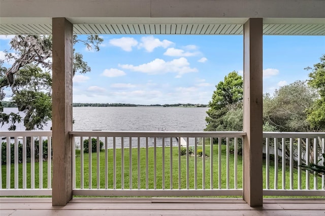 6136 Lake Emma Rd, Groveland, FL 34736 - wooden terrace featuring a water view and a lawn