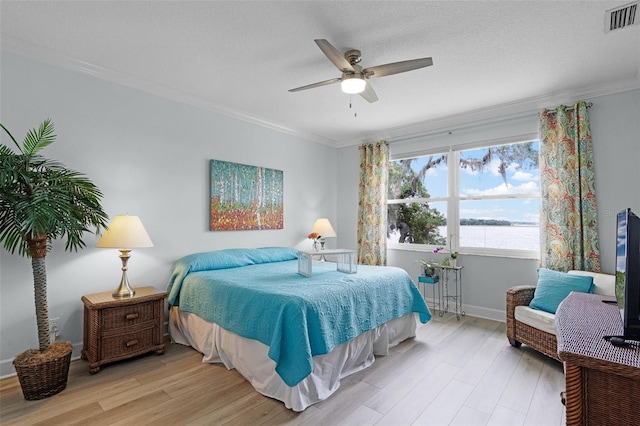6136 Lake Emma Rd, Groveland, FL 34736 - bedroom with ornamental molding, light wood-type flooring, and a ceiling fan