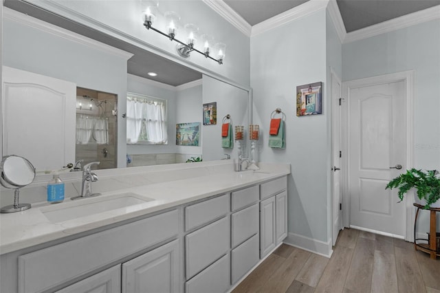 6136 Lake Emma Rd, Groveland, FL 34736 - bathroom featuring wood finished floors, double vanity, ornamental molding, and a shower with door