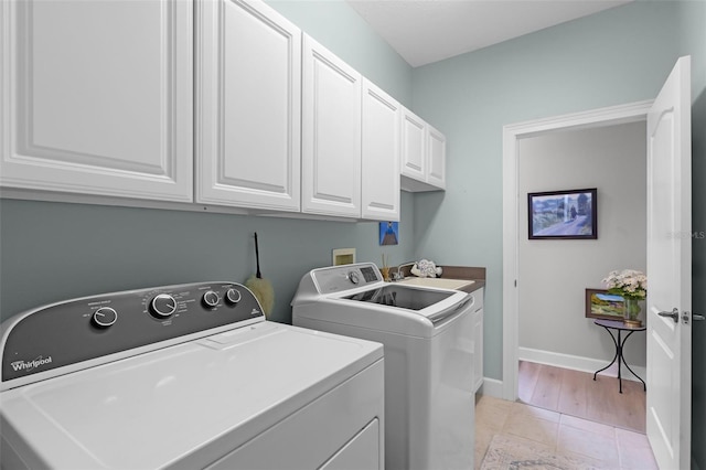6136 Lake Emma Rd, Groveland, FL 34736 - laundry room featuring separate washer and dryer and cabinet space