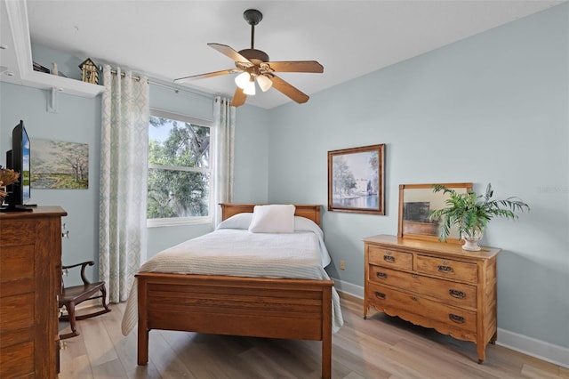 6136 Lake Emma Rd, Groveland, FL 34736 - bedroom with light wood-style flooring and a ceiling fan