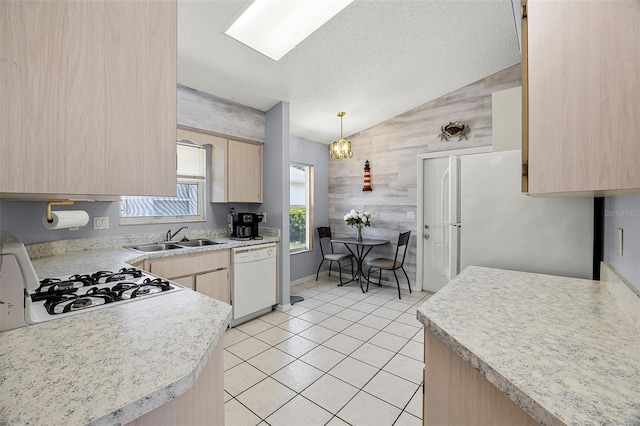 5507 Laver St, Leesburg, FL 34748 - kitchen featuring white appliances, light brown cabinets, vaulted ceiling, light countertops, and light tile patterned floors