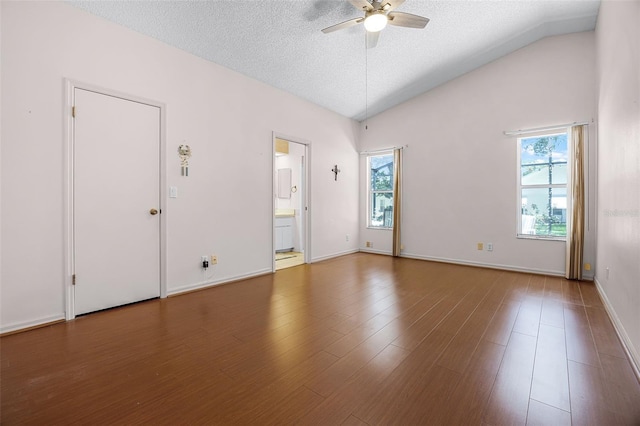 5507 Laver St, Leesburg, FL 34748 - unfurnished room featuring ceiling fan, lofted ceiling, a textured ceiling, and wood finished floors