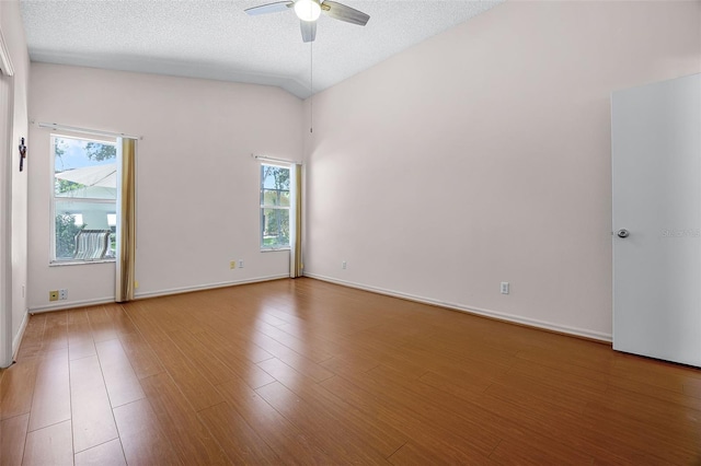5507 Laver St, Leesburg, FL 34748 - empty room featuring ceiling fan, wood finished floors, and a textured ceiling