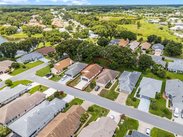 5507 Laver St, Leesburg, FL 34748 - aerial view of residential area featuring property boundaries highlighted and a large body of water