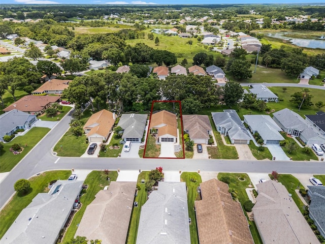 5507 Laver St, Leesburg, FL 34748 - aerial view of residential area with property parcel outlined and a large body of water