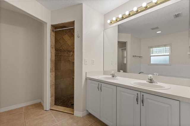 5729 Bible Camp Rd, Groveland, FL 34736 - full bathroom with double vanity, tiled shower, and tile patterned flooring