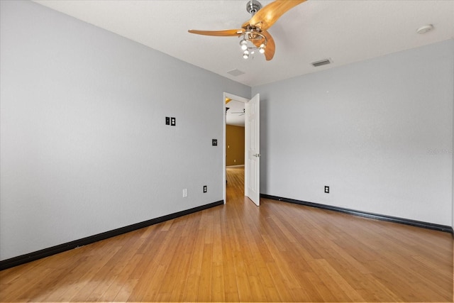 5729 Bible Camp Rd, Groveland, FL 34736 - spare room with light wood finished floors, ceiling fan, and a smoke detector