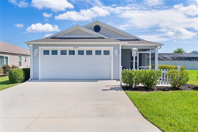 3283 Dawn Pl, The Villages, FL 32163 - view of front of property with driveway, a garage, and roof with shingles