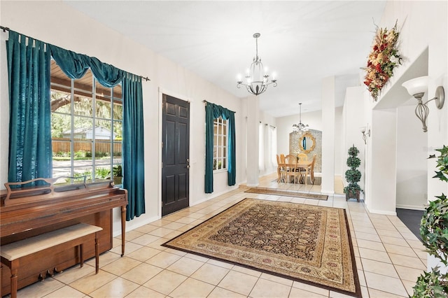 81 N Carol Ave, Mascotte, FL 34753 - foyer with tile patterned flooring and a chandelier