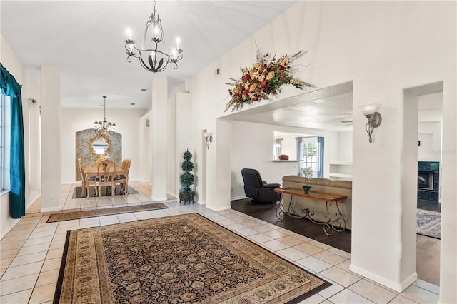 81 N Carol Ave, Mascotte, FL 34753 - tiled entryway with a chandelier and a high end fireplace