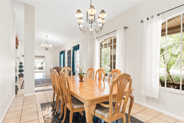 81 N Carol Ave, Mascotte, FL 34753 - dining room with a chandelier, light tile patterned flooring, and healthy amount of natural light