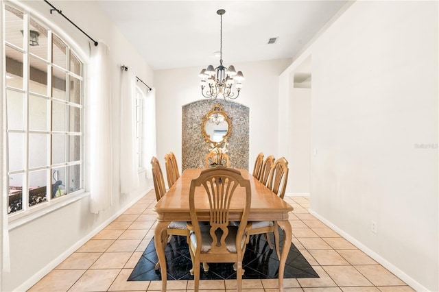 81 N Carol Ave, Mascotte, FL 34753 - dining space with a chandelier and light tile patterned flooring