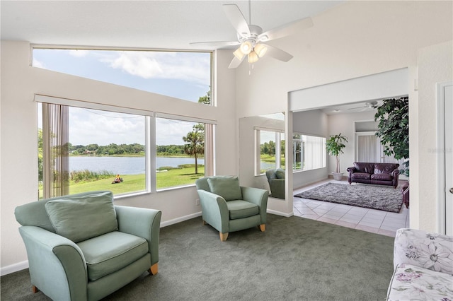 81 N Carol Ave, Mascotte, FL 34753 - sitting room featuring a water view, ceiling fan, carpet flooring, and a towering ceiling