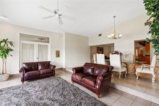 81 N Carol Ave, Mascotte, FL 34753 - tiled living room with ceiling fan, a chandelier, and high vaulted ceiling