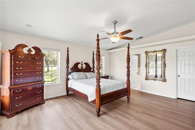81 N Carol Ave, Mascotte, FL 34753 - bedroom with light wood-type flooring, lofted ceiling, and a ceiling fan
