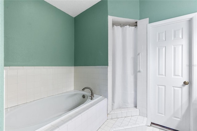 81 N Carol Ave, Mascotte, FL 34753 - full bath featuring a bath and tiled shower