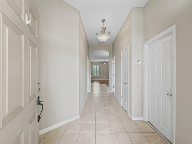 10927 SE 168th Loop, Summerfield, FL 34491 - hall with light tile patterned floors and arched walkways