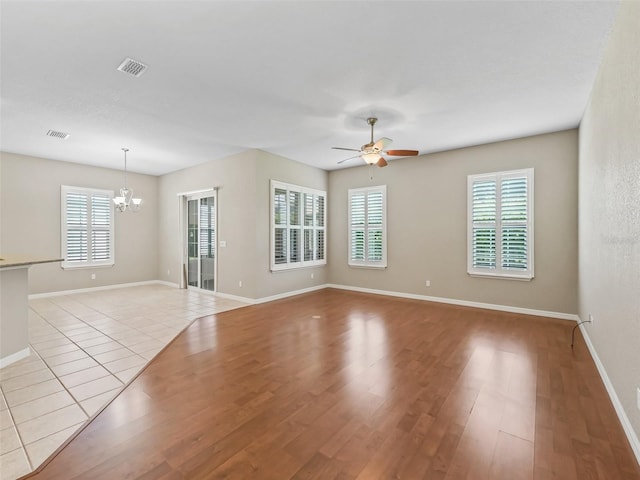 10927 SE 168th Loop, Summerfield, FL 34491 - spare room featuring a chandelier, a ceiling fan, and light wood finished floors