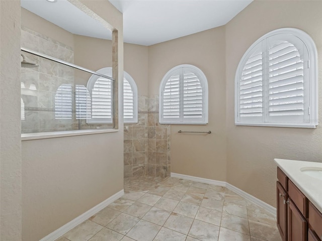 10927 SE 168th Loop, Summerfield, FL 34491 - bathroom featuring vanity, a walk in shower, and tile patterned flooring