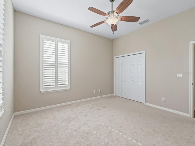 10927 SE 168th Loop, Summerfield, FL 34491 - unfurnished bedroom with carpet flooring, a closet, and ceiling fan