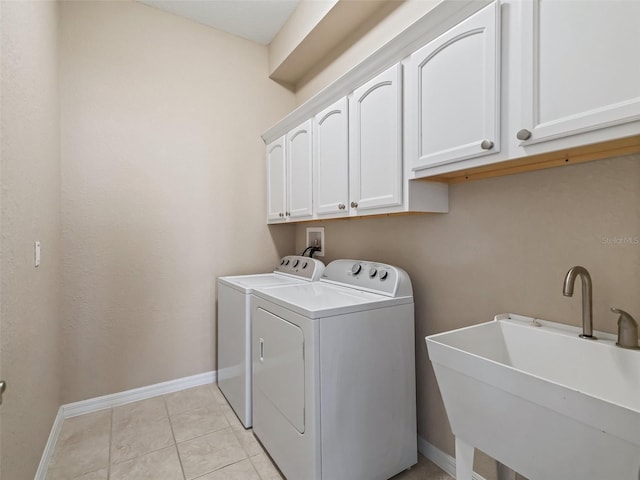 10927 SE 168th Loop, Summerfield, FL 34491 - laundry area with cabinet space, washer and dryer, and light tile patterned floors