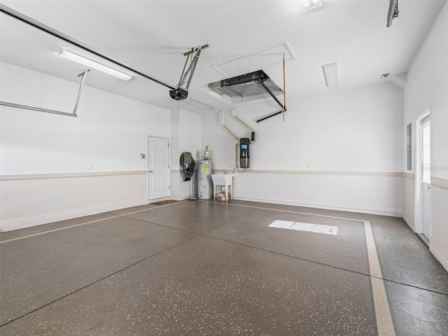 10927 SE 168th Loop, Summerfield, FL 34491 - garage with a garage door opener and electric water heater