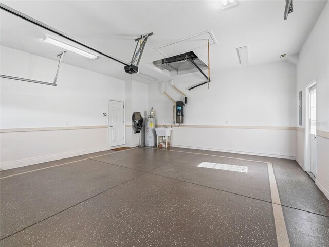 10927 SE 168th Loop, Summerfield, FL 34491 - garage featuring a garage door opener and water heater