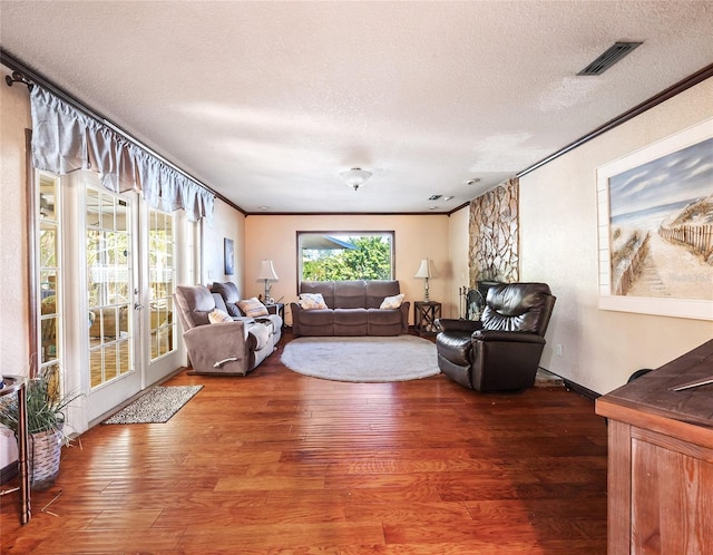 15733 Tower View Dr, Clermont, FL 34711 - living room featuring a textured ceiling, wood finished floors, and ornamental molding