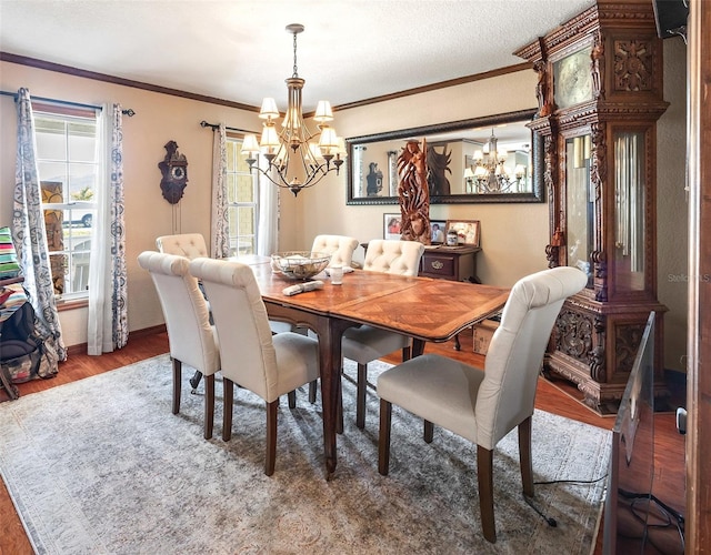 15733 Tower View Dr, Clermont, FL 34711 - dining room with a chandelier, wood finished floors, and ornamental molding