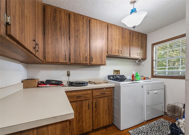 15733 Tower View Dr, Clermont, FL 34711 - laundry room with dark wood-type flooring, independent washer and dryer, and cabinet space