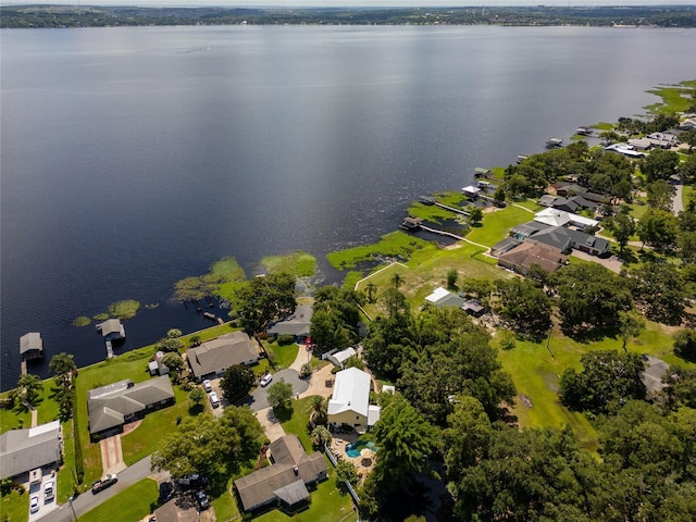 15733 Tower View Dr, Clermont, FL 34711 - aerial view of property and surrounding area with a large body of water and nearby suburban area
