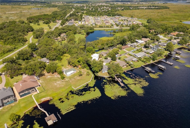 15733 Tower View Dr, Clermont, FL 34711 - aerial view of property and surrounding area featuring a large body of water and nearby suburban area