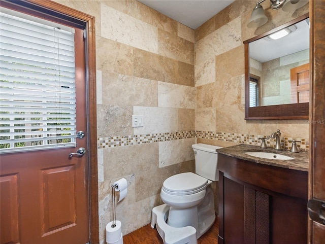 15733 Tower View Dr, Clermont, FL 34711 - half bath featuring tile walls, vanity, and tasteful backsplash