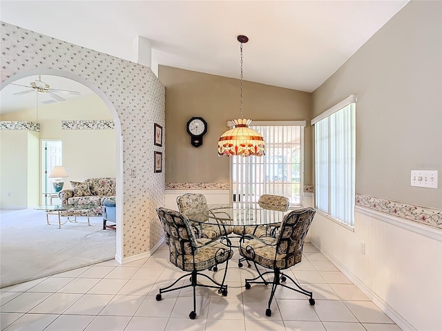 13700 SE 90th Ct, Summerfield, FL 34491 - dining room featuring lofted ceiling, ceiling fan, light tile patterned floors, light colored carpet, and wallpapered walls
