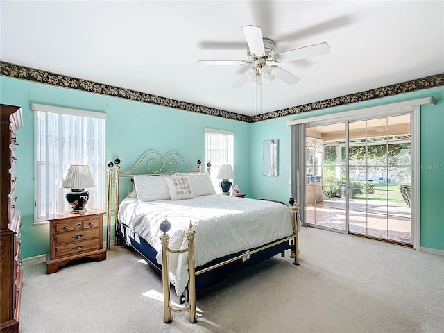 13700 SE 90th Ct, Summerfield, FL 34491 - bedroom featuring access to outside, carpet flooring, and a ceiling fan