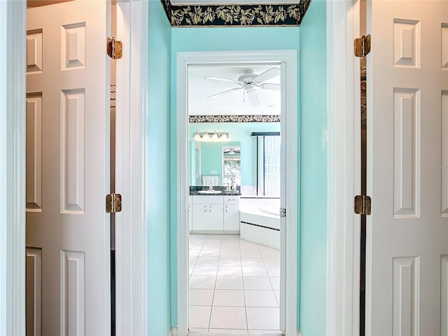 13700 SE 90th Ct, Summerfield, FL 34491 - hallway featuring light tile patterned flooring and a sink