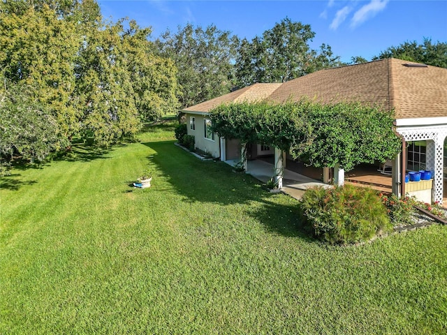 13700 SE 90th Ct, Summerfield, FL 34491 - view of green lawn featuring a wooden deck