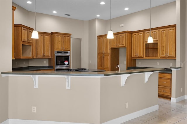 7303 Spring Mountain Ln, Yalaha, FL 34797 - kitchen featuring dark countertops, light tile patterned flooring, open shelves, stainless steel appliances, and brown cabinetry