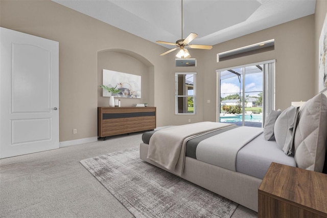 7303 Spring Mountain Ln, Yalaha, FL 34797 - bedroom with access to outside, light colored carpet, and ceiling fan