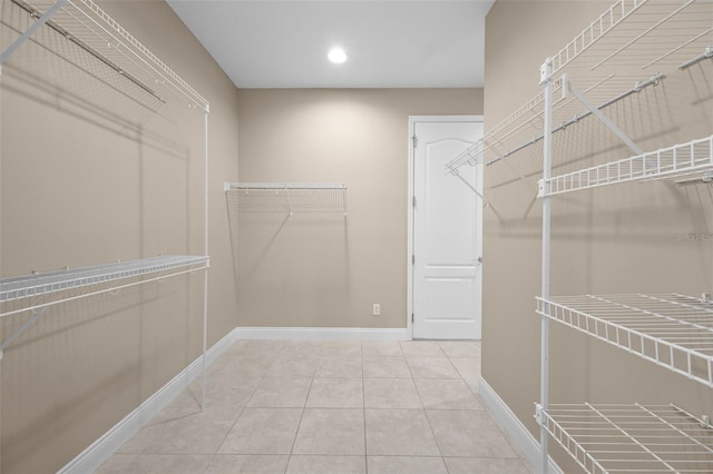 7303 Spring Mountain Ln, Yalaha, FL 34797 - walk in closet featuring light tile patterned flooring